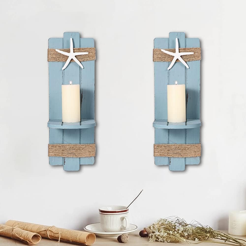 Two Candle Wall Sconces that are blue with rope on the top and bottom. There are starfish on top of them.